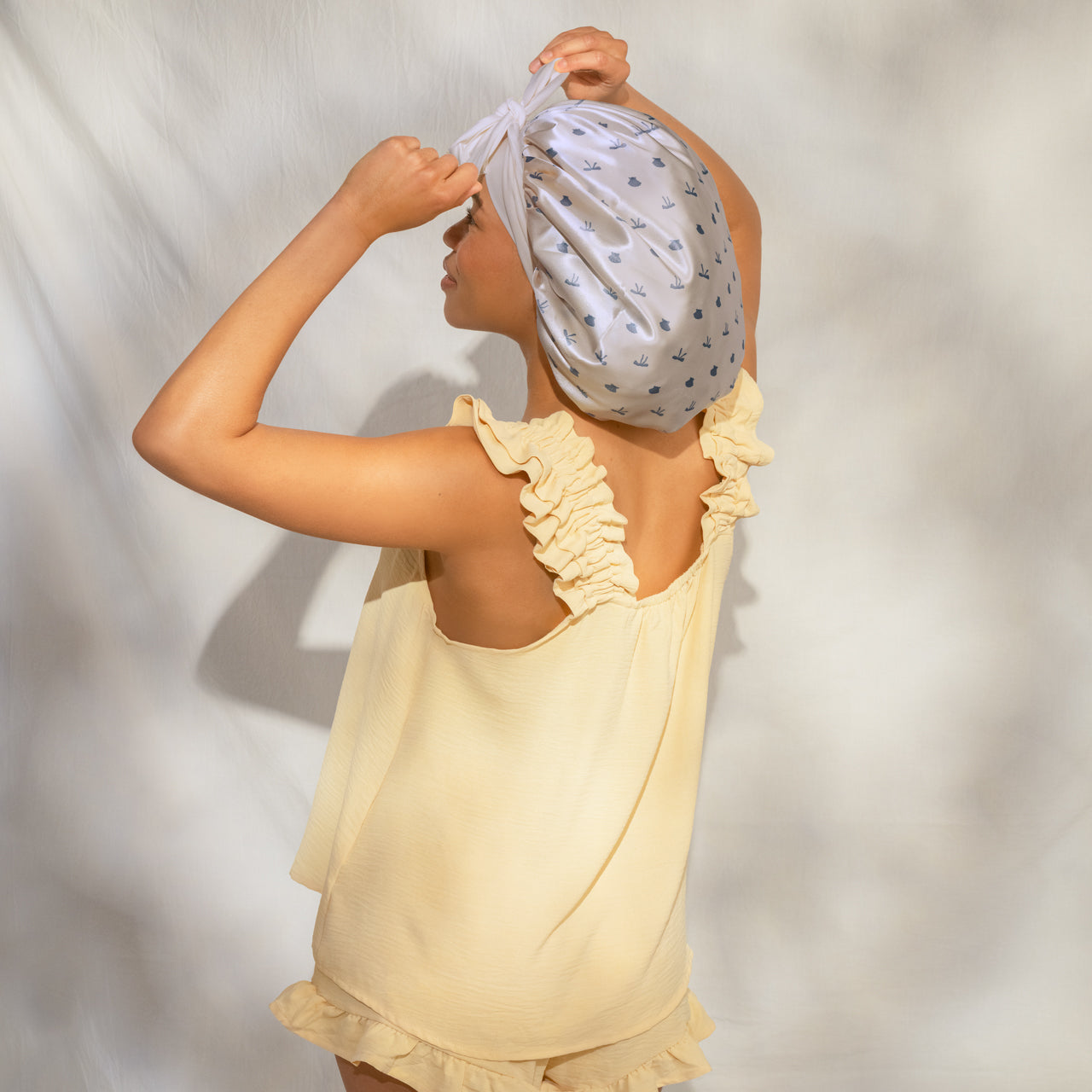 509518-CoastalCottage-OversizedSatinBonnet-PearlizedCream_CoastalBlue-Model-3-1280x1280px.jpg